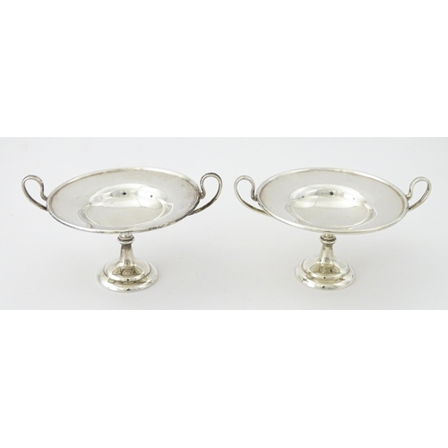 349 - A pair of silver twin handled pedestal bon bon dishes of tazza form, hallmarked London 1904, maker H... 