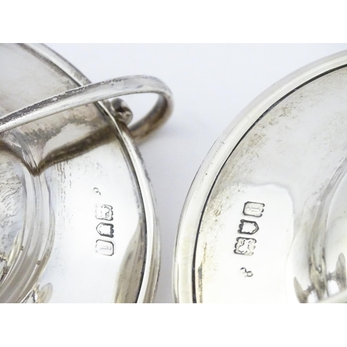 349 - A pair of silver twin handled pedestal bon bon dishes of tazza form, hallmarked London 1904, maker H... 