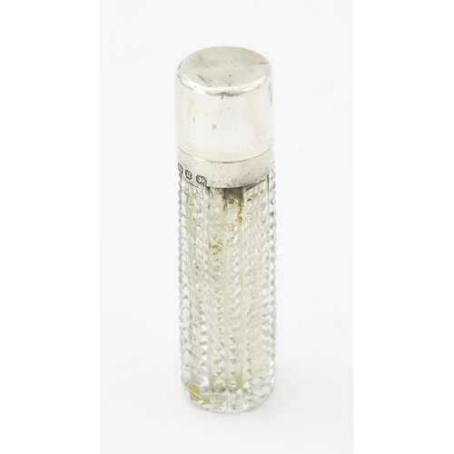 356 - A Victorian cut glass scent / perfume bottle with hinged silver lid, hallmarked Birmingham 1894, mak... 