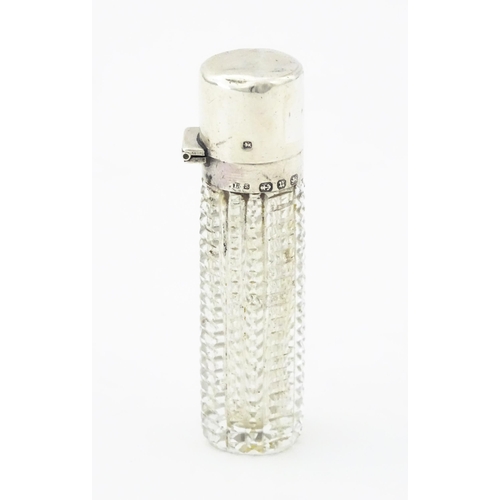 356 - A Victorian cut glass scent / perfume bottle with hinged silver lid, hallmarked Birmingham 1894, mak... 