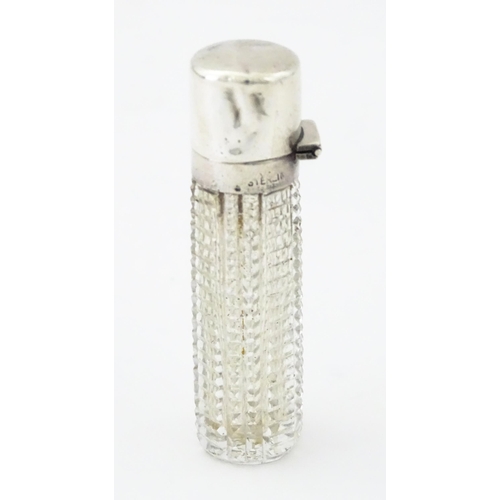 356 - A Victorian cut glass scent / perfume bottle with hinged silver lid, hallmarked Birmingham 1894, mak... 