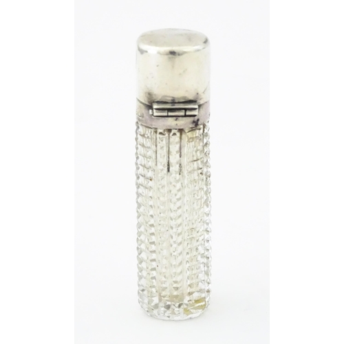 356 - A Victorian cut glass scent / perfume bottle with hinged silver lid, hallmarked Birmingham 1894, mak... 