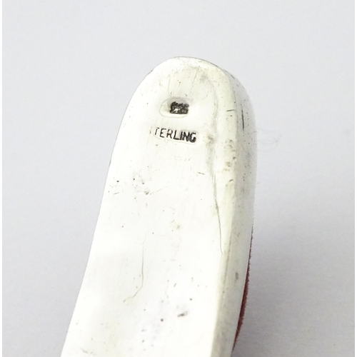 358 - A .925 silver novelty pin cushion formed as a shoe / slipper. Approx. 1 1/2