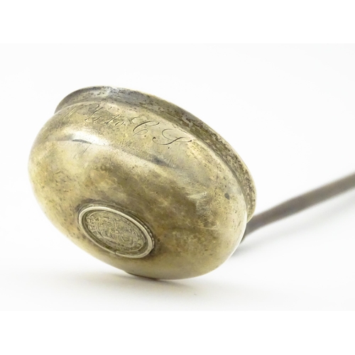 360 - A white metal toddy ladle with turned wooden handle, with inset 1816 coin style detail to centre. Ap... 