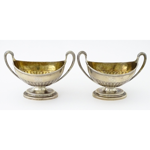 361 - A pair of George III silver twin handled salts with gilded interiors, hallmarked London 1784, maker ... 