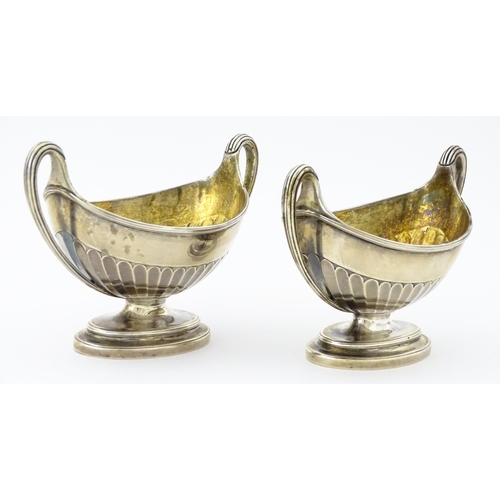 361 - A pair of George III silver twin handled salts with gilded interiors, hallmarked London 1784, maker ... 