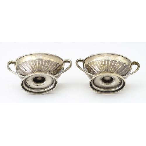 361 - A pair of George III silver twin handled salts with gilded interiors, hallmarked London 1784, maker ... 