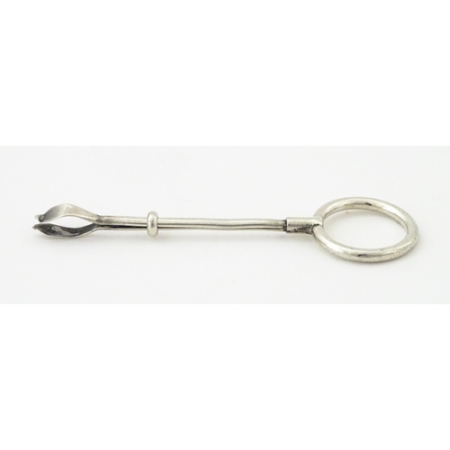 366 - A silver cigarette holder with ring to one end, hallmarked London 1937, maker Cohen & Charles. Appro... 