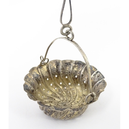 372 - A Chinese Export silver strainer of basket form with engraved decoration and spout hanger