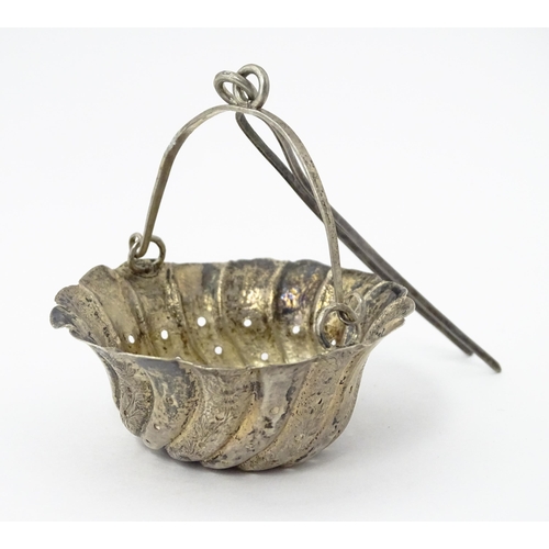 372 - A Chinese Export silver strainer of basket form with engraved decoration and spout hanger