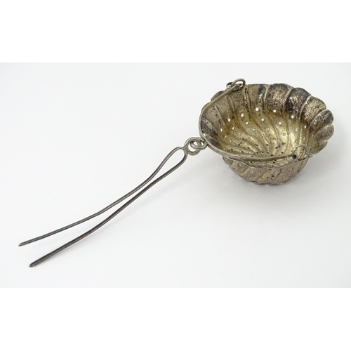 372 - A Chinese Export silver strainer of basket form with engraved decoration and spout hanger