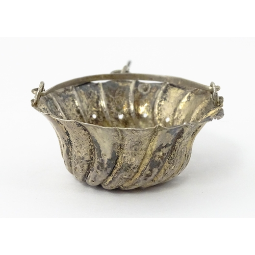 372 - A Chinese Export silver strainer of basket form with engraved decoration and spout hanger