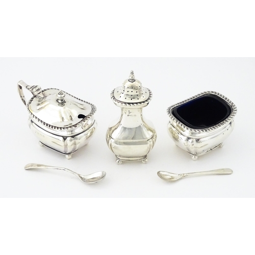 377 - A silver three piece cruet set comprising, salt, pepper and mustard hallmarked Birmingham 1917, make... 