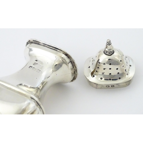 377 - A silver three piece cruet set comprising, salt, pepper and mustard hallmarked Birmingham 1917, make... 