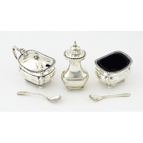 377 - A silver three piece cruet set comprising, salt, pepper and mustard hallmarked Birmingham 1917, make... 