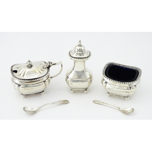 377 - A silver three piece cruet set comprising, salt, pepper and mustard hallmarked Birmingham 1917, make... 