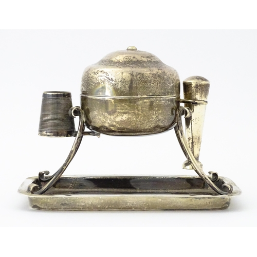 378 - A silver smoker's companion comprising central lidded container flanked by vesta keep and tamper, ra... 