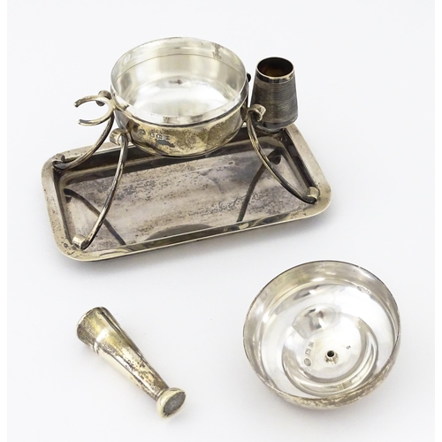 378 - A silver smoker's companion comprising central lidded container flanked by vesta keep and tamper, ra... 