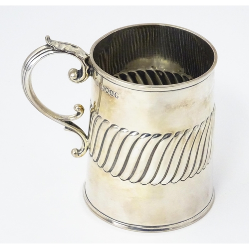 381 - A Victorian silver mug / tankard with banded detail hallmarked London 1885, maker William Hutton & S... 