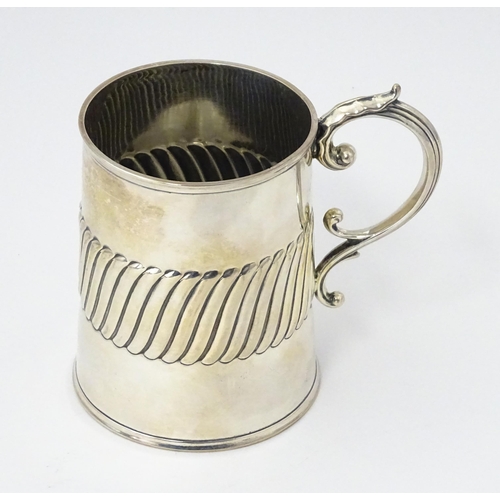 381 - A Victorian silver mug / tankard with banded detail hallmarked London 1885, maker William Hutton & S... 