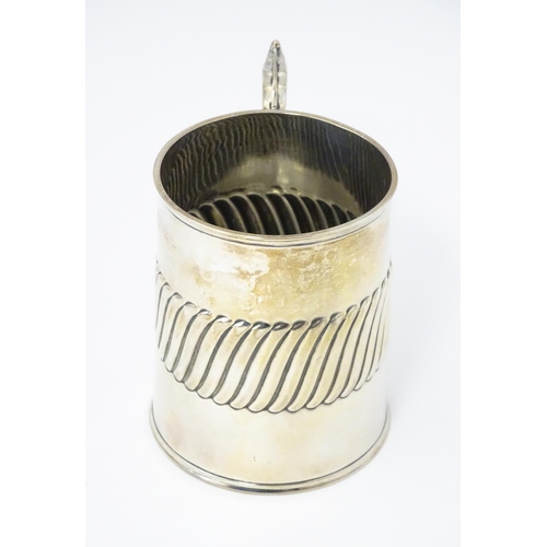 381 - A Victorian silver mug / tankard with banded detail hallmarked London 1885, maker William Hutton & S... 