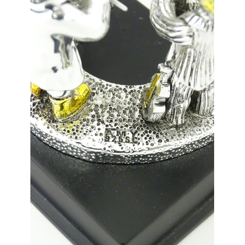 385 - A .925 Israeli silver model of a trio of Jewish musicians, by Amy. Bears plaque to base. In the mann... 