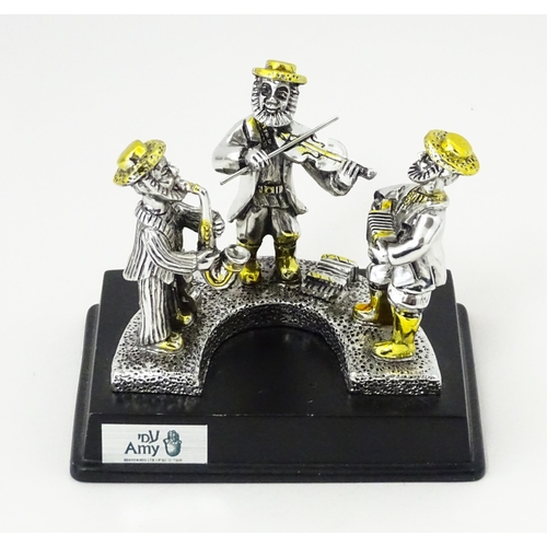 385 - A .925 Israeli silver model of a trio of Jewish musicians, by Amy. Bears plaque to base. In the mann... 