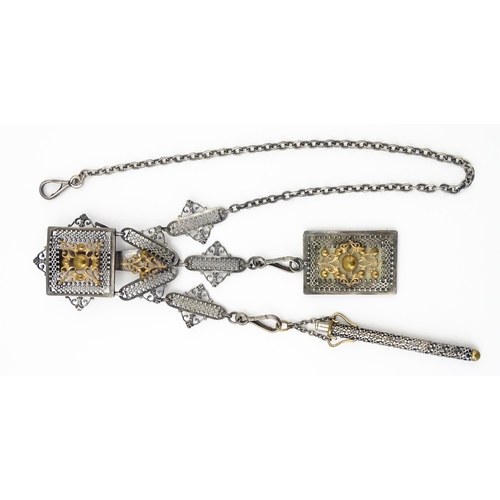 386 - A late 19th / early 20thC silver plate chatelaine with gilt metal highlights, having three hanging c... 