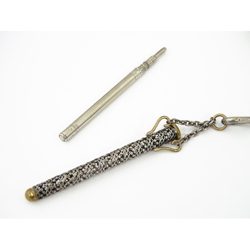 386 - A late 19th / early 20thC silver plate chatelaine with gilt metal highlights, having three hanging c... 