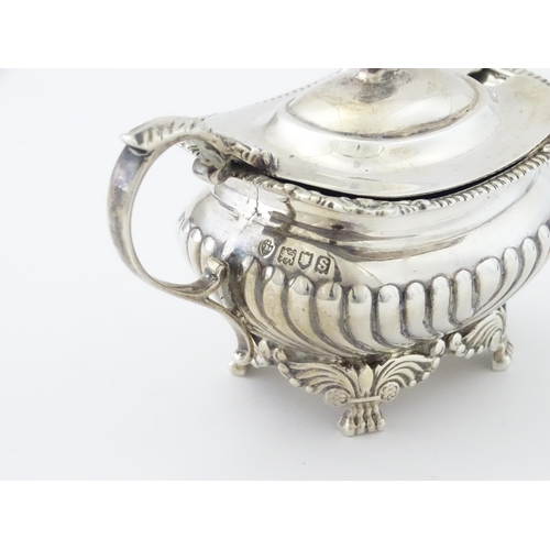 387 - A matched silver three piece cruet comprising salt, pepper and mustard, hallmarked London 1913 / 191... 