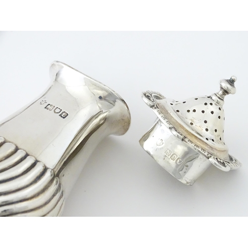 387 - A matched silver three piece cruet comprising salt, pepper and mustard, hallmarked London 1913 / 191... 