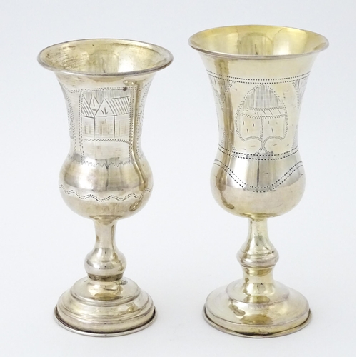 392 - Two silver kiddush cups hallmarked London 1900 / 1905, maker Rubin Koshr / Kusher. Largest approx. 5... 