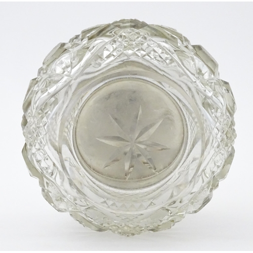 396 - A cut glass dressing table pot with silver lid hallmarked Birmingham 1923, maker Samuel M Levi. Appr... 