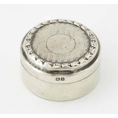 398 - A small silver pill box, hallmarked Birmingham 1917, maker Levi & Salaman. Approx. 1 1/2