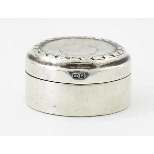 398 - A small silver pill box, hallmarked Birmingham 1917, maker Levi & Salaman. Approx. 1 1/2