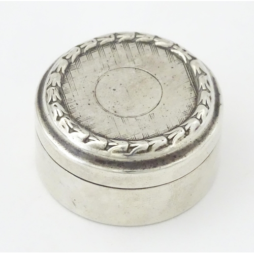 398 - A small silver pill box, hallmarked Birmingham 1917, maker Levi & Salaman. Approx. 1 1/2