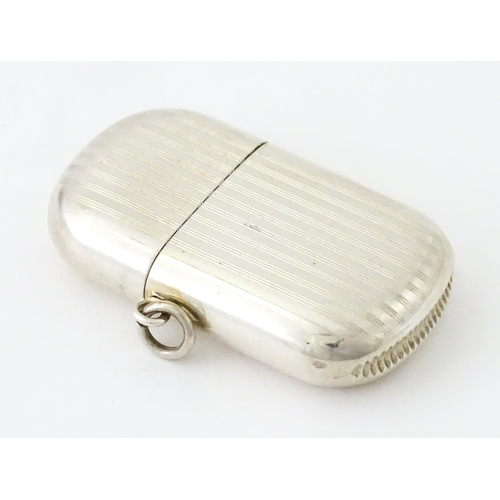 407 - A silver vesta case with pull off lid and banded engine turned decoration, hallmarked Birmingham 191... 