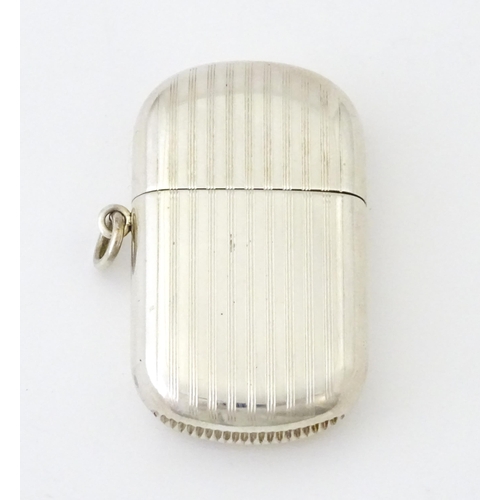 407 - A silver vesta case with pull off lid and banded engine turned decoration, hallmarked Birmingham 191... 