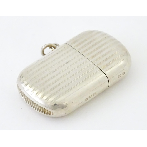 407 - A silver vesta case with pull off lid and banded engine turned decoration, hallmarked Birmingham 191... 