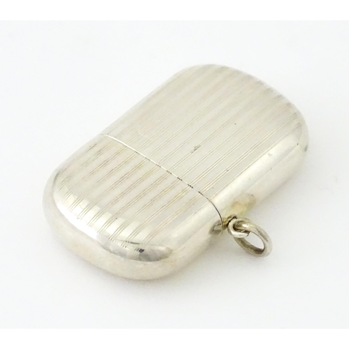 407 - A silver vesta case with pull off lid and banded engine turned decoration, hallmarked Birmingham 191... 