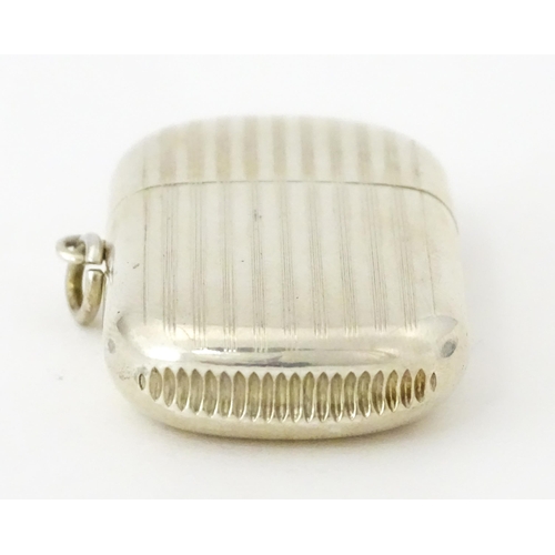 407 - A silver vesta case with pull off lid and banded engine turned decoration, hallmarked Birmingham 191... 