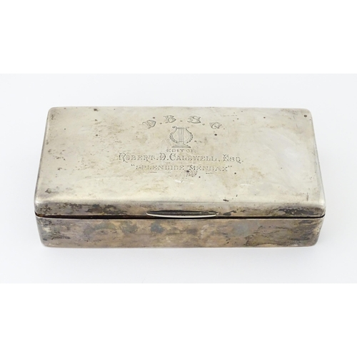 444 - A silver cigarette box with hinged lid and three sectional interior, hallmarked Birmingham 1904, mak... 