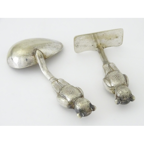 448 - A silver plate child's spoon and pusher with teddy bear detail to handle. Largest approx. 3 3/4