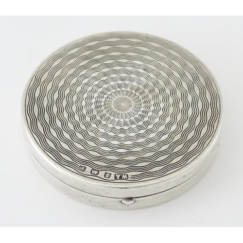 452 - An Art Deco silver compact with engine turned decoration and mirror to lid, hallmarked Birmingham 19... 