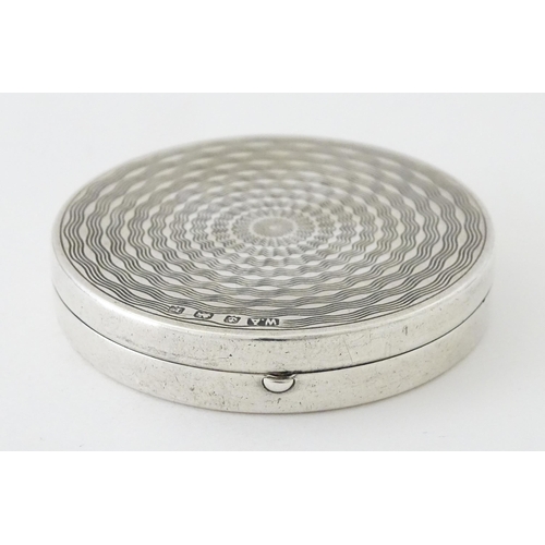 452 - An Art Deco silver compact with engine turned decoration and mirror to lid, hallmarked Birmingham 19... 