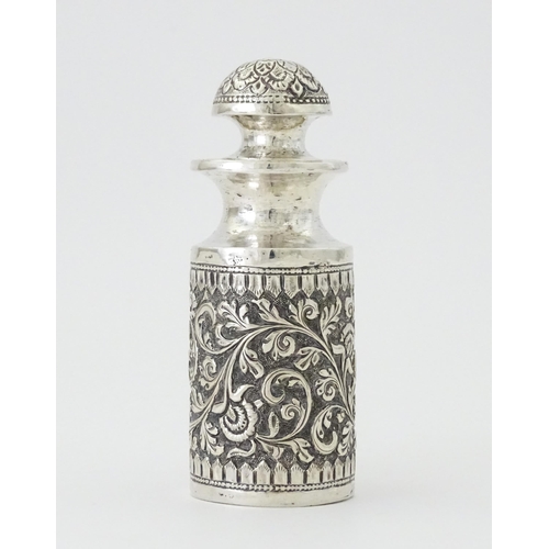 455 - A white metal scent / perfume bottle with acanthus scroll detail. Possibly Indian. Approx. 3 3/4