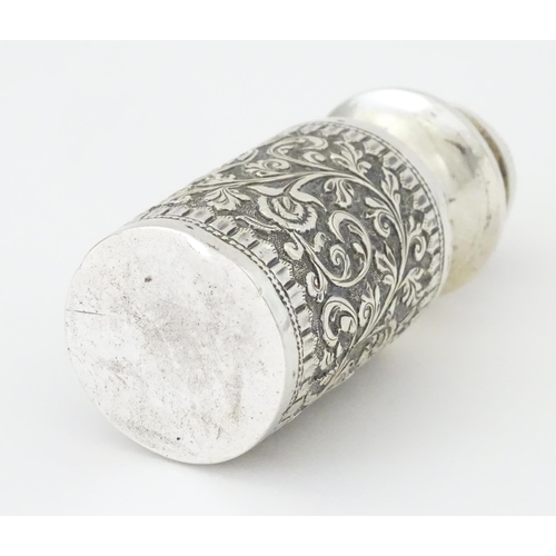 455 - A white metal scent / perfume bottle with acanthus scroll detail. Possibly Indian. Approx. 3 3/4