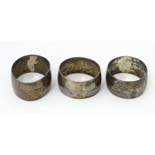 459 - Three white metal napkin rings with niello decoration depicting Egyptian scenes with camels, River N... 