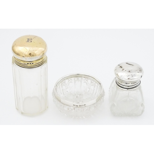 462 - A cut glass salts bottle with silver top hallmarked London 1923, maker Henry Perkins & Sons, a dress... 