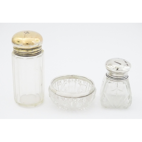 462 - A cut glass salts bottle with silver top hallmarked London 1923, maker Henry Perkins & Sons, a dress... 